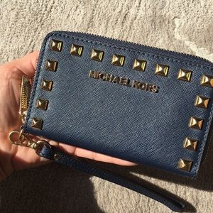 Very gently used Michael Kors Studded wristlet. Navy - Original tags included!